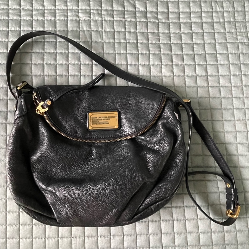 Marc Jacob’s crossbody bag. Black leather. Edgy look, lots of room/pockets.